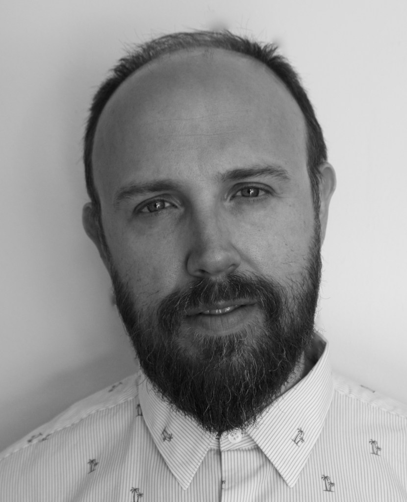 black and white headshot of James Stibbs